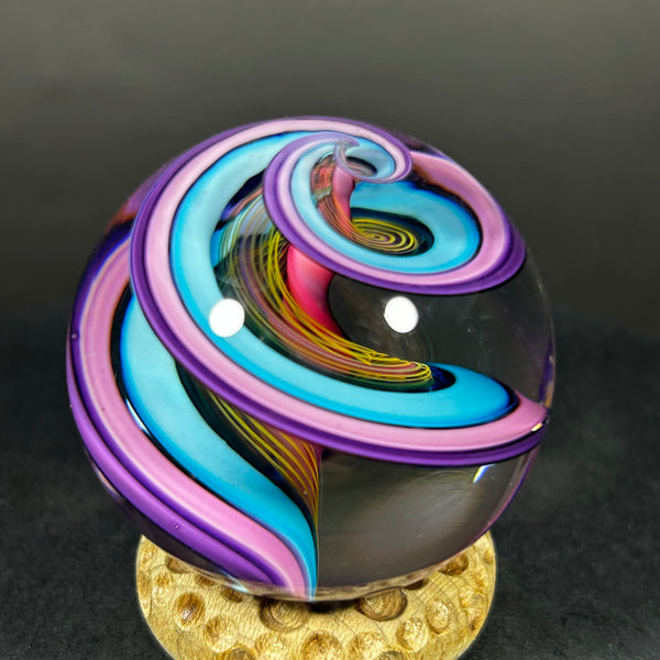 Geoffrey Beetem Art Glass Marble, pink core, wide double band in blue, pink and yellow  1.57”