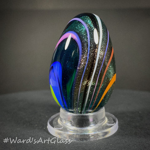 Rolf Wald Art Glass Egg, Solid Lutz Core with Bent Fine Line Rainbow 1.50"