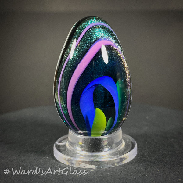 Rolf Wald Art Glass Egg, Solid Lutz Core with Bent Fine Line Rainbow 1.50"