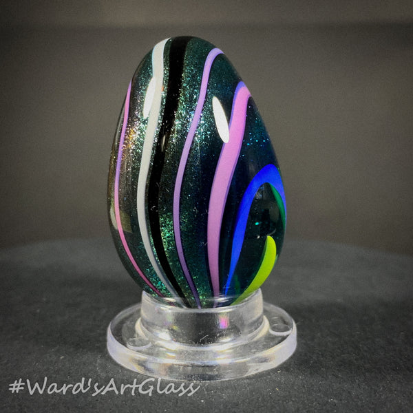 Rolf Wald Art Glass Egg, Solid Lutz Core with Bent Fine Line Rainbow 1.50"