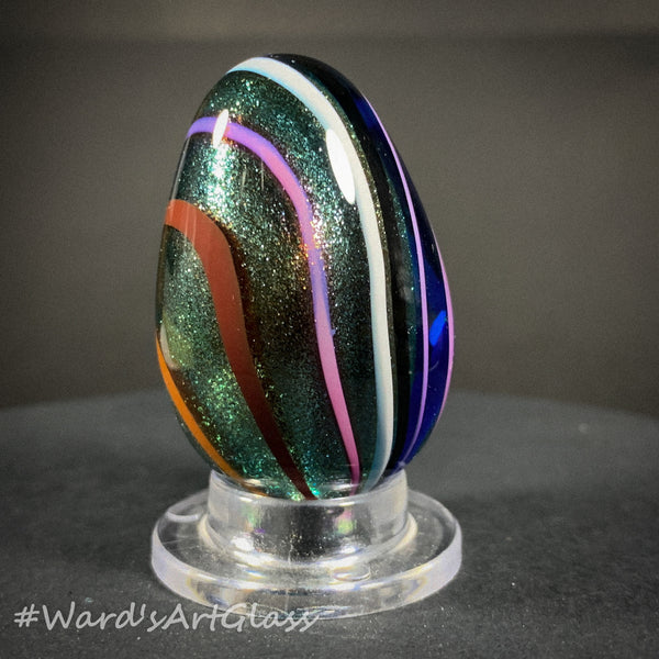 Rolf Wald Art Glass Egg, Solid Lutz Core with Bent Fine Line Rainbow 1.50"