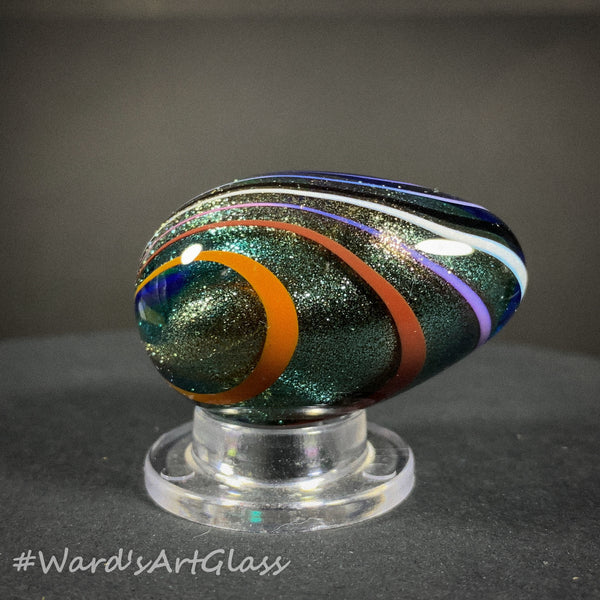 Rolf Wald Art Glass Egg, Solid Lutz Core with Bent Fine Line Rainbow 1.50"