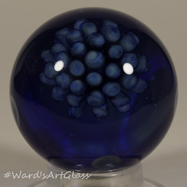 Chris Rice, Big Blue Bouquet over Translucent Blue Sparkle and Dot stack, Boro Marble. 1.67"