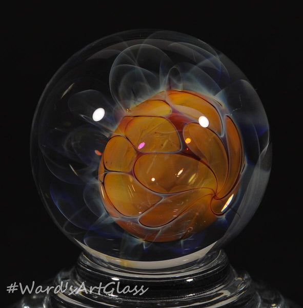 Andrew Groner Carmel bead floating in a fumed webbing, with ghost plumes. 1 1/8” - Ward's Art Glass, [product type] - Art Glass, Marble