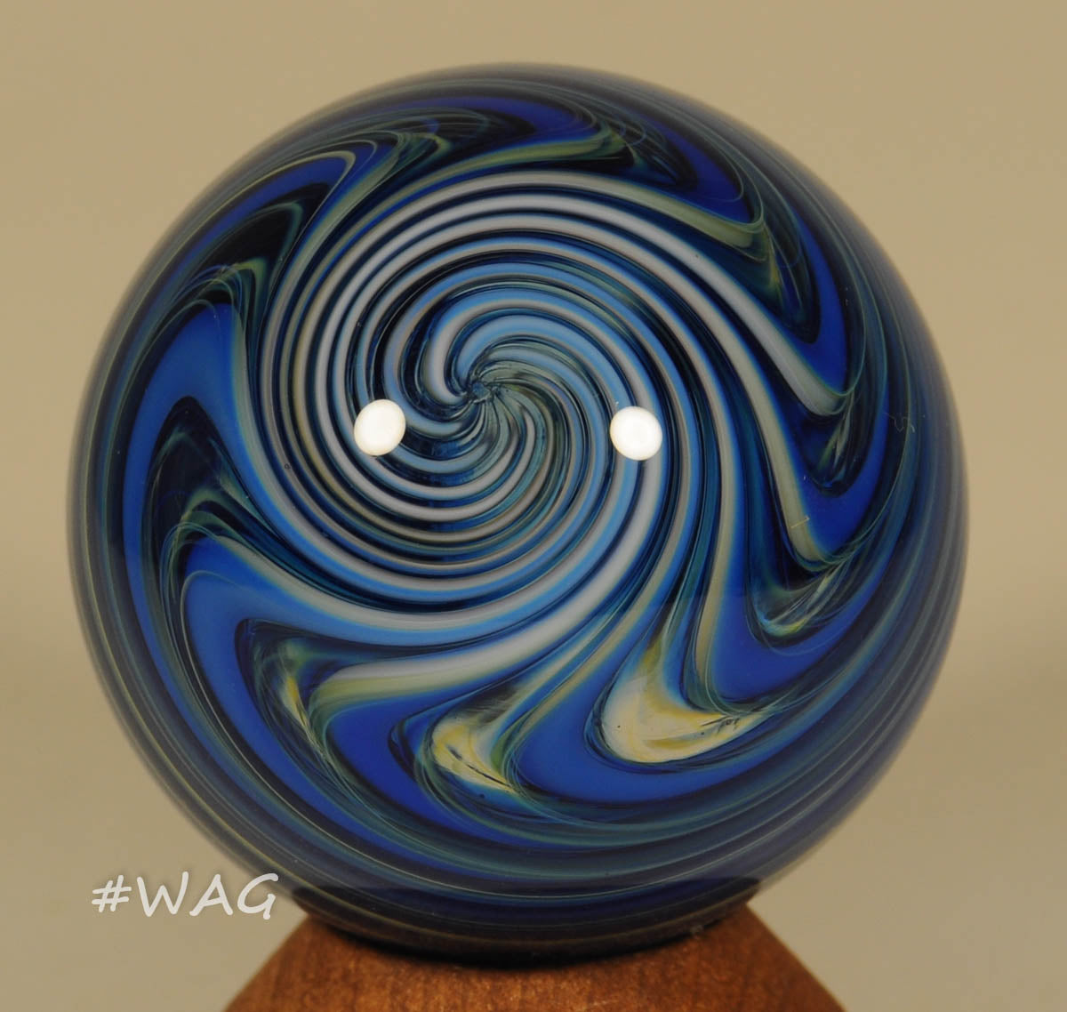 Fritz Lauenstein Furnace Soft glass Marble, Blue band waves over clear core - floating, 1.58" - Ward's Art Glass, [product type] - Art Glass, Marble